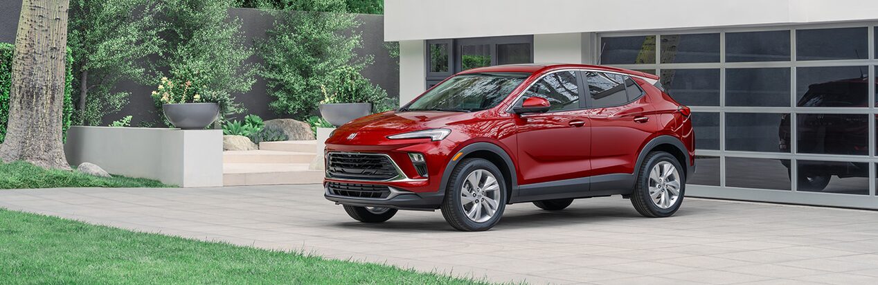 Red Buick SUV Parked in Driveway Facing Away from the Garage