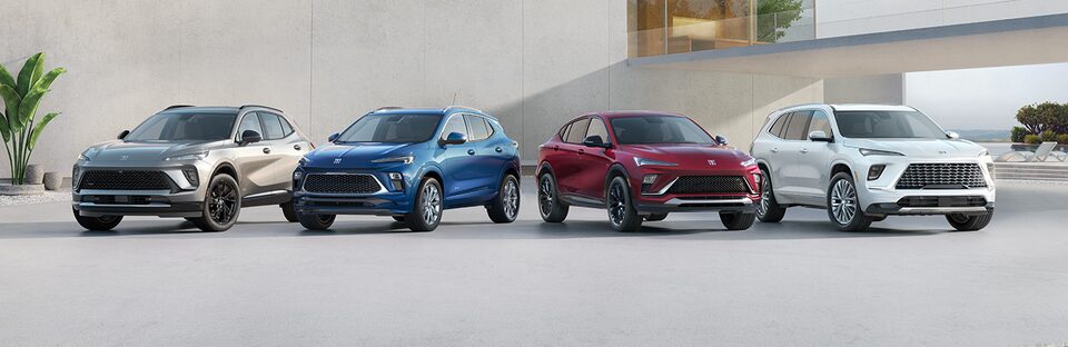 Grey, Blue, Red, and White Buick SUVs Parked Next to Each Other