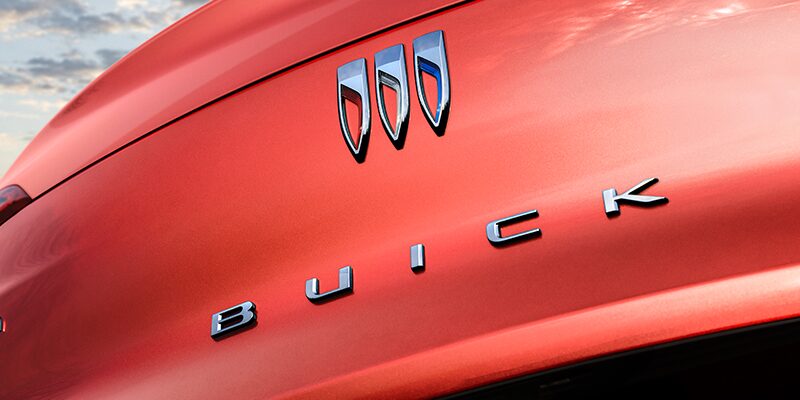 Up Close Shot of Buick Logo on a Red Vehicle