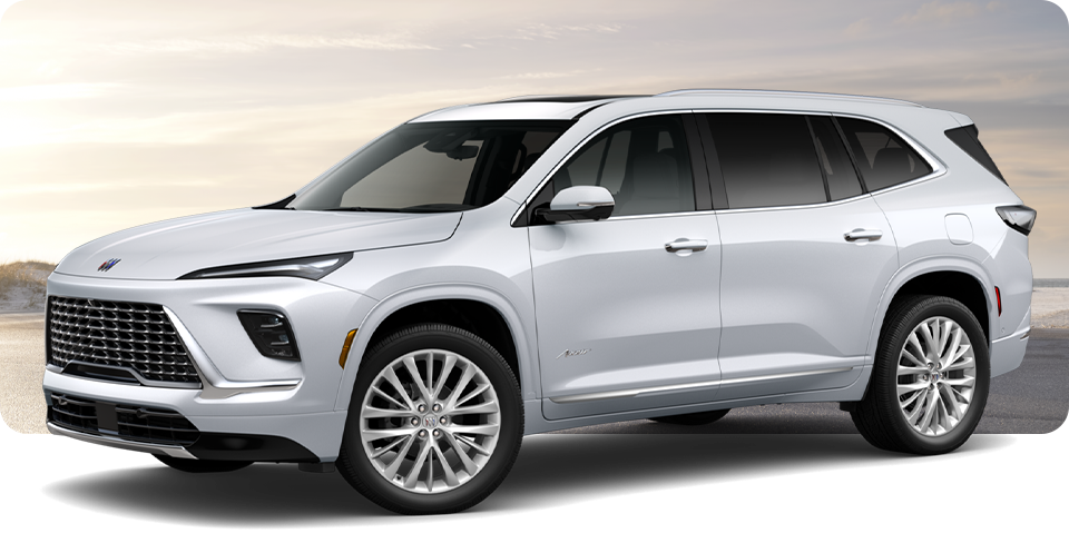 Front-Three Quarter View of a White Buick Enclave Avenir Luxury Mid-Size SUV Parked Near a Beach
