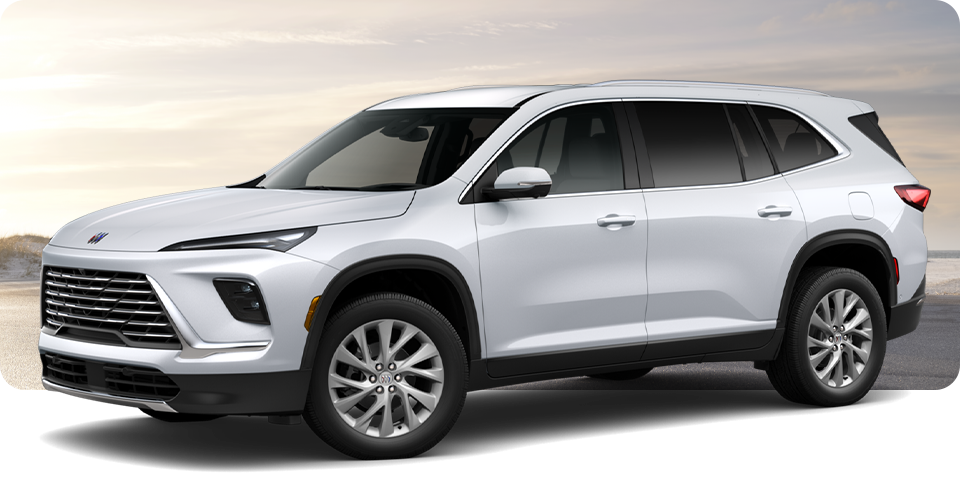 Front-Three Quarter View of a White Buick Enclave Mid-Size SUV Parked Near a Beach