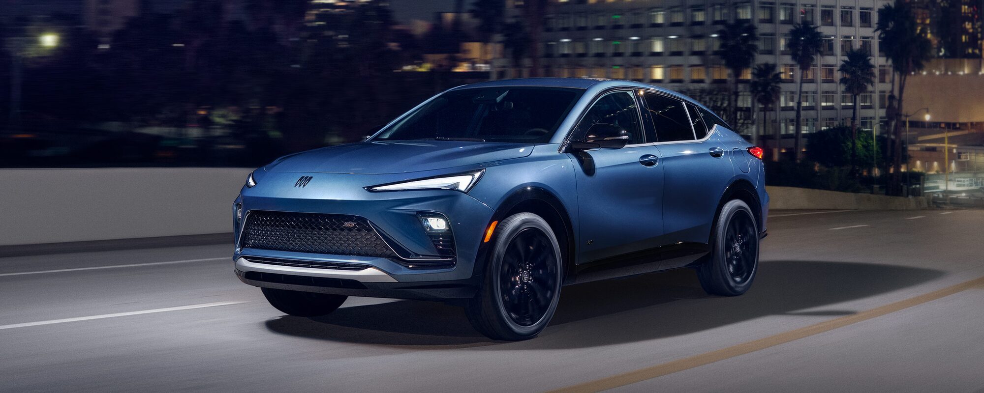 The 2024 Buick Encore GX ST Parked In Driveway Of Modern Home