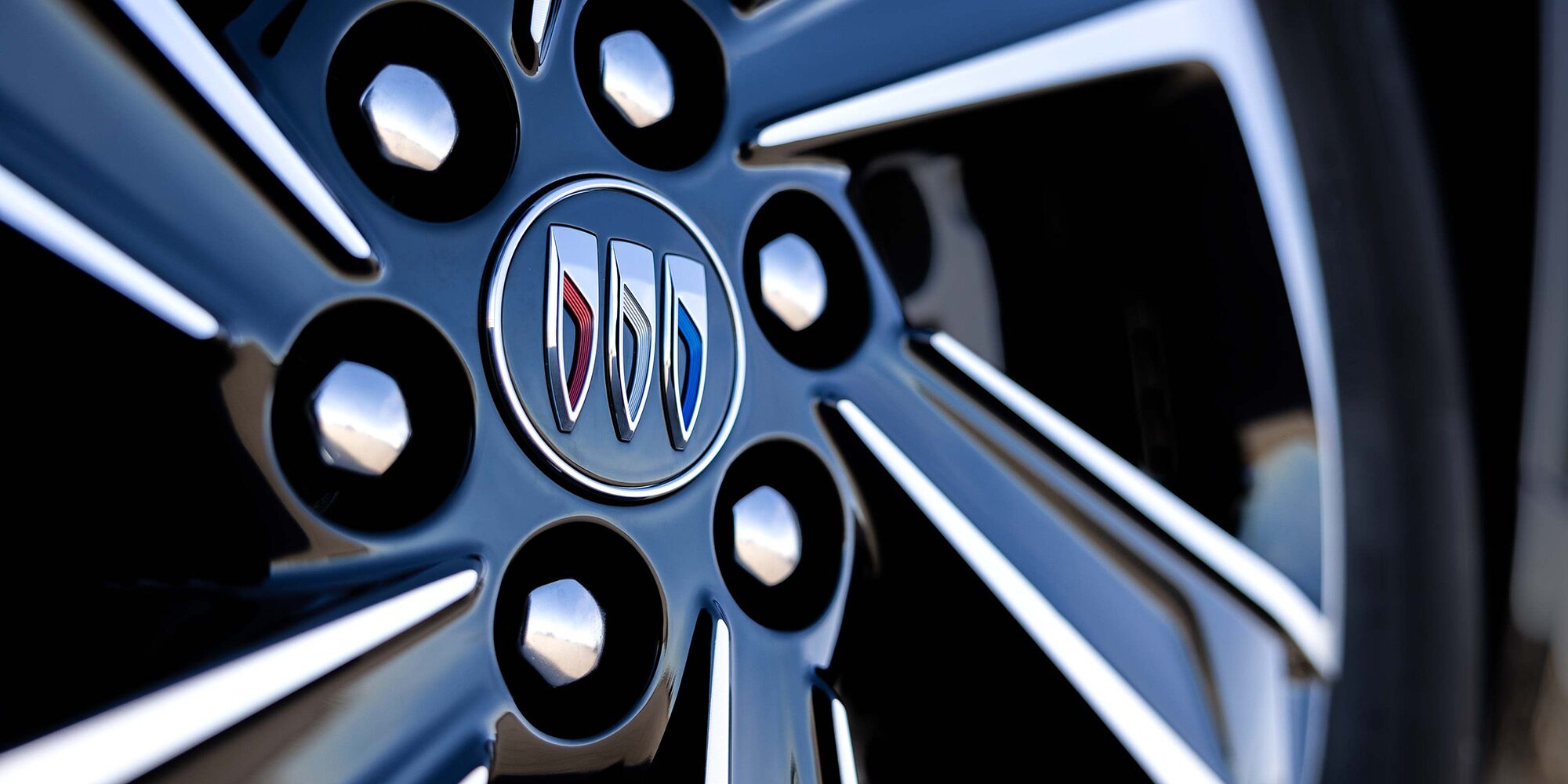Close-up of a 2026 Buick Enclave Tire Focusing on the Buick Emblem at the Center