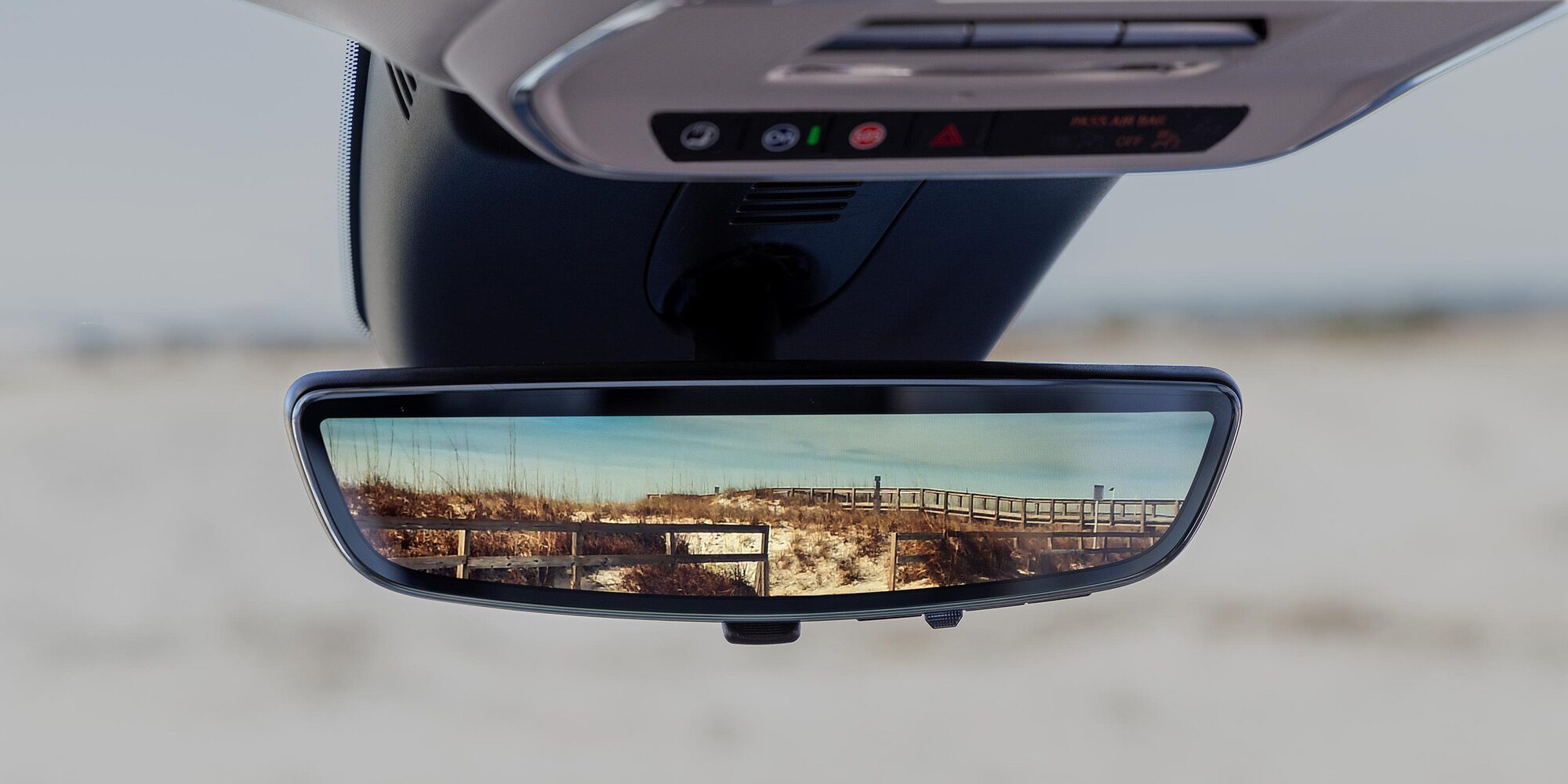 Close-up of the Rear View Mirror Showing a Desert View