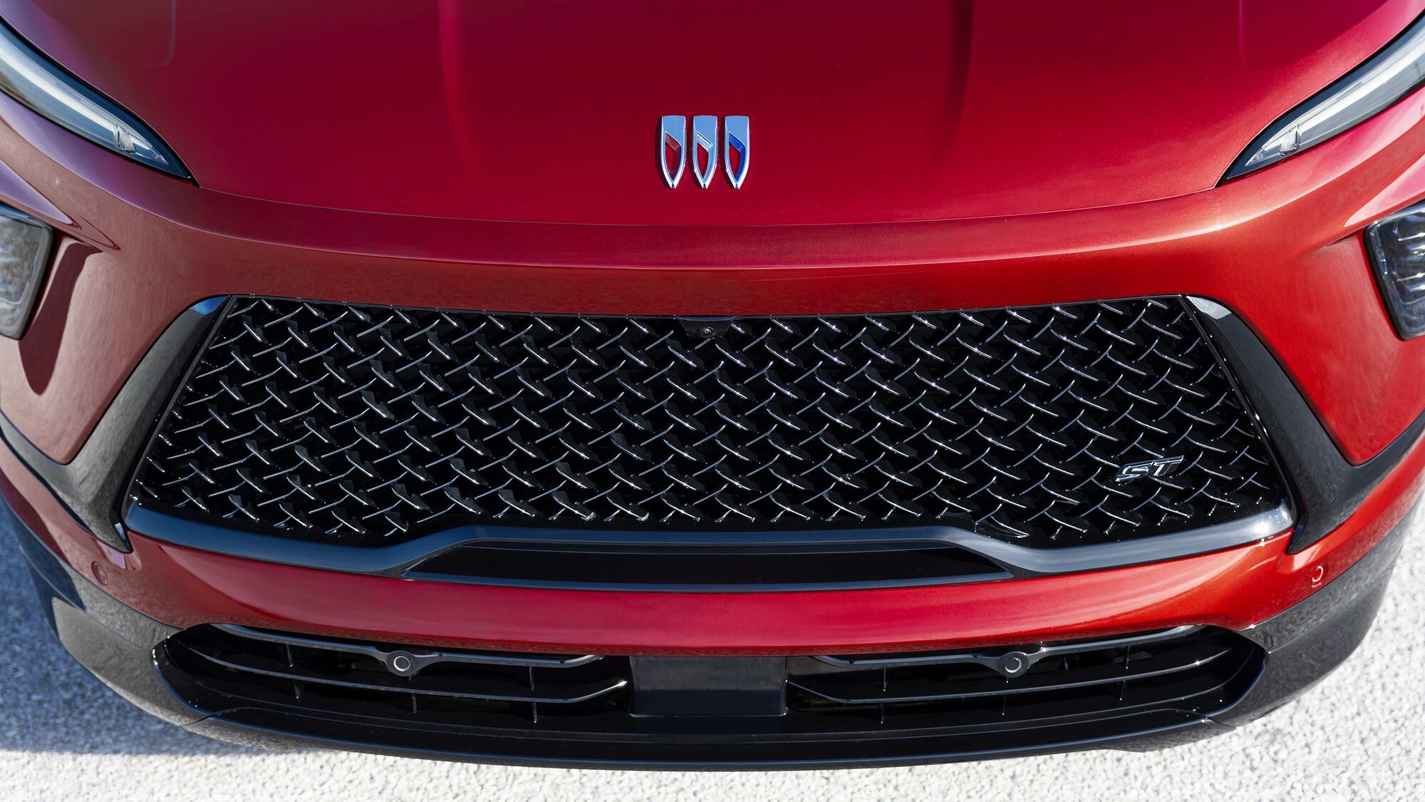Overhead View of a the Hood and Grille of a 2026 Red Buick Enclave