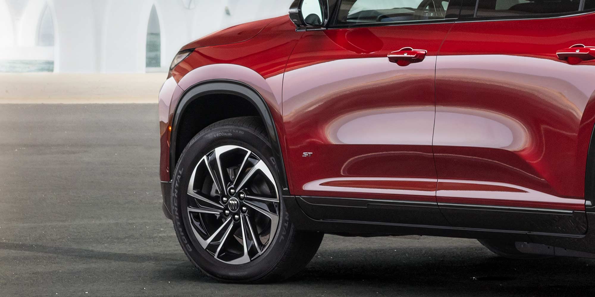 Close-up View of a Red Buick 2026 Enclave Front Tire