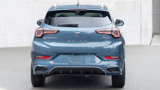 Rear view of the 2026 Buick Encore GX parked in a driveway.