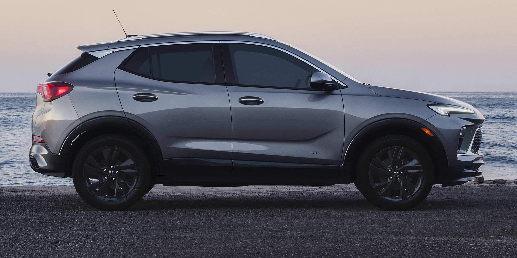 Side view of the 2026 Buick Encore GX parked alone outdoors.