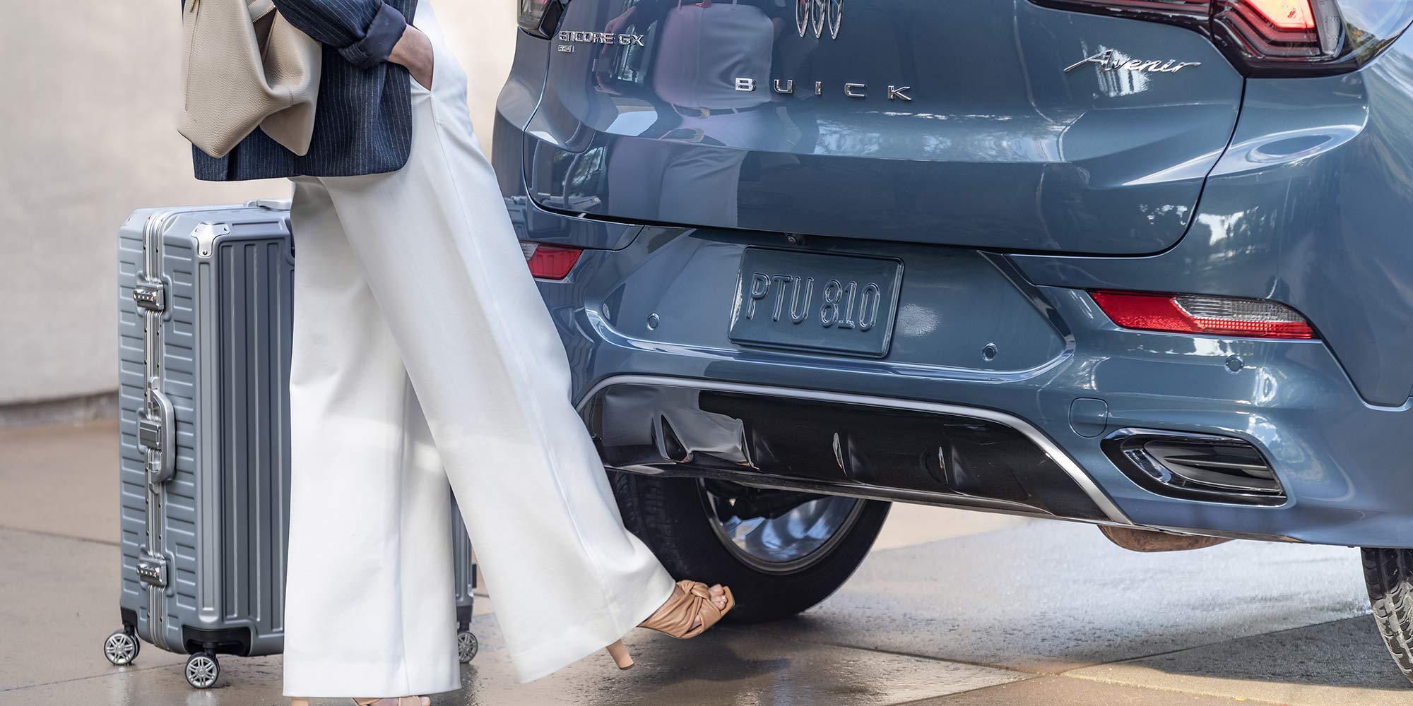 A person utilizing the Power Liftgate function of the 2026 Encore GX.