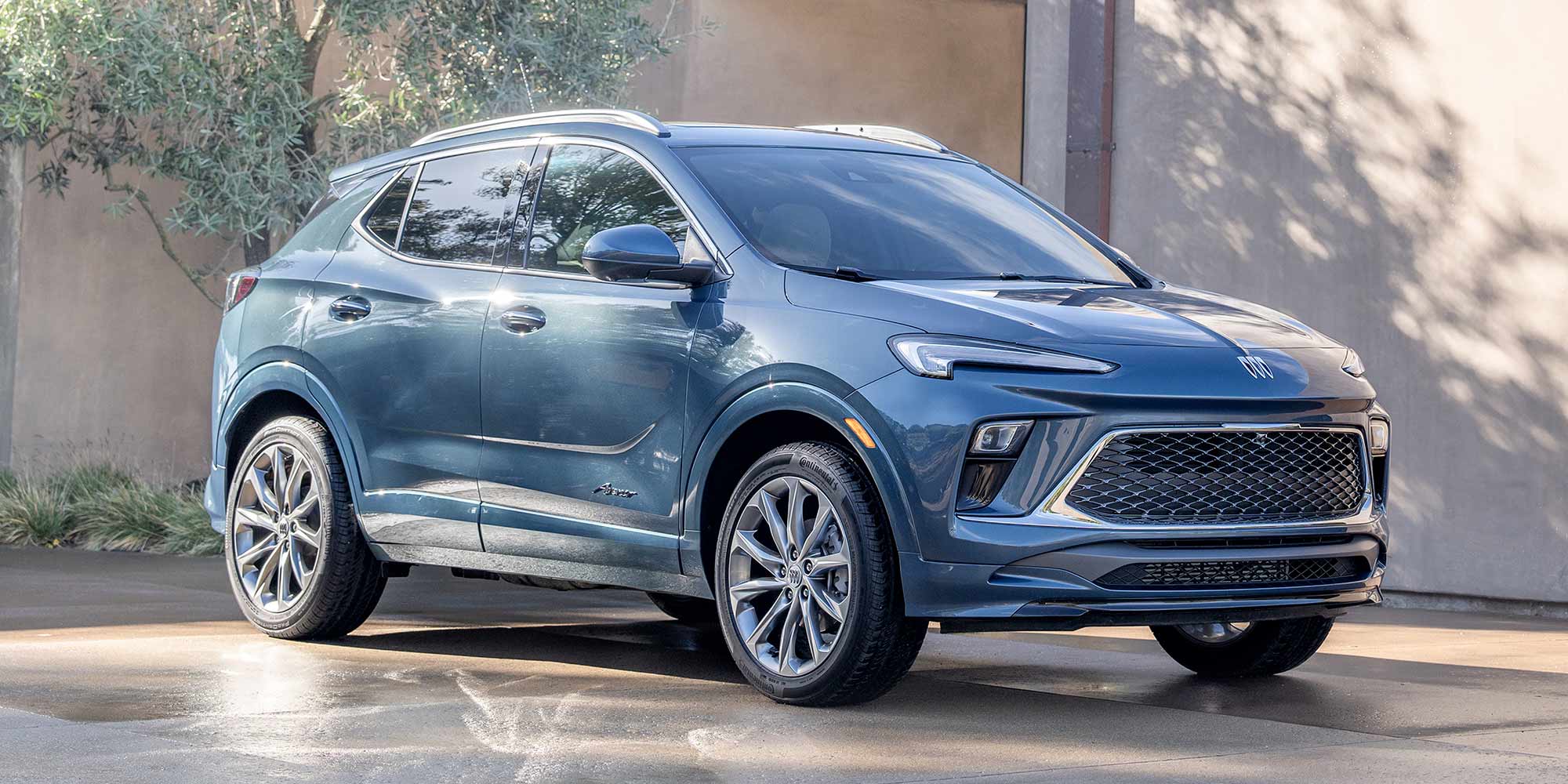 Front-side view of the 2026 Buick Encore GX parked in a home driveway.