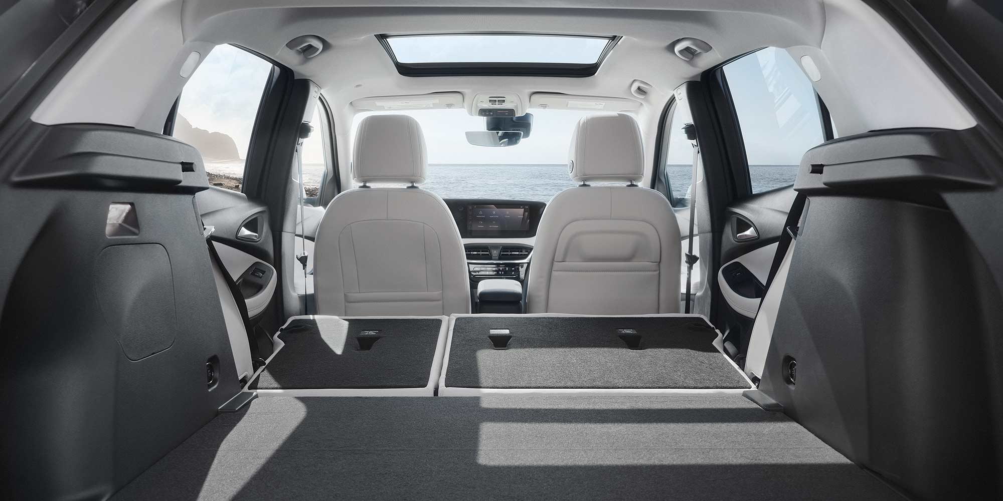Spacious interiors of the 2026 Buick Encore GX with the rear seats folded down.