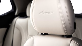 Close up view of the Avenir badging on the headrest of the 2026 Encore GX Avenir.