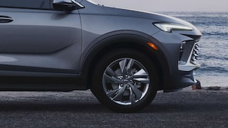 Side view of the 2026 Buick Encore GX Preferred parked by the beach.