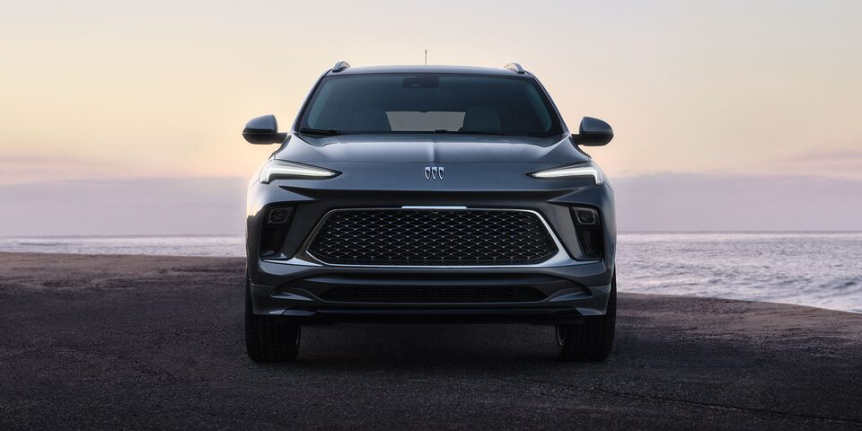 Front View of the 2026 Buick Encore GX Small SUV Parked on the Beach at Sunset