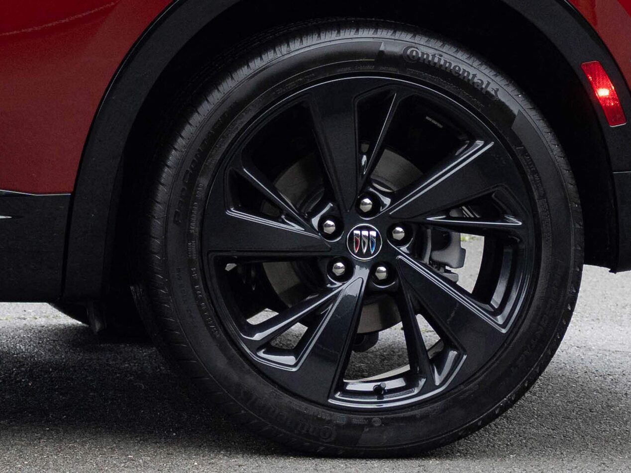 Close-up of the 20 Inch Carbon Flash Metallic Painted Alloy Wheels on the 2026 Buick Envision ST Sporty Compact SUV