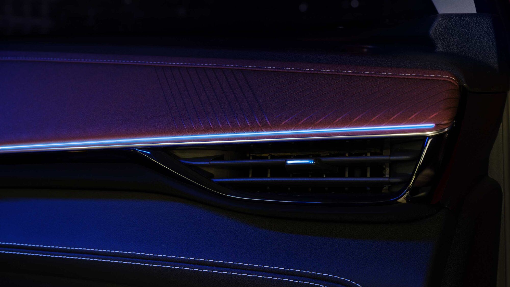 Close-up of the Air Vent in the 2026 Buick Envision with a Blue and Purple Hue