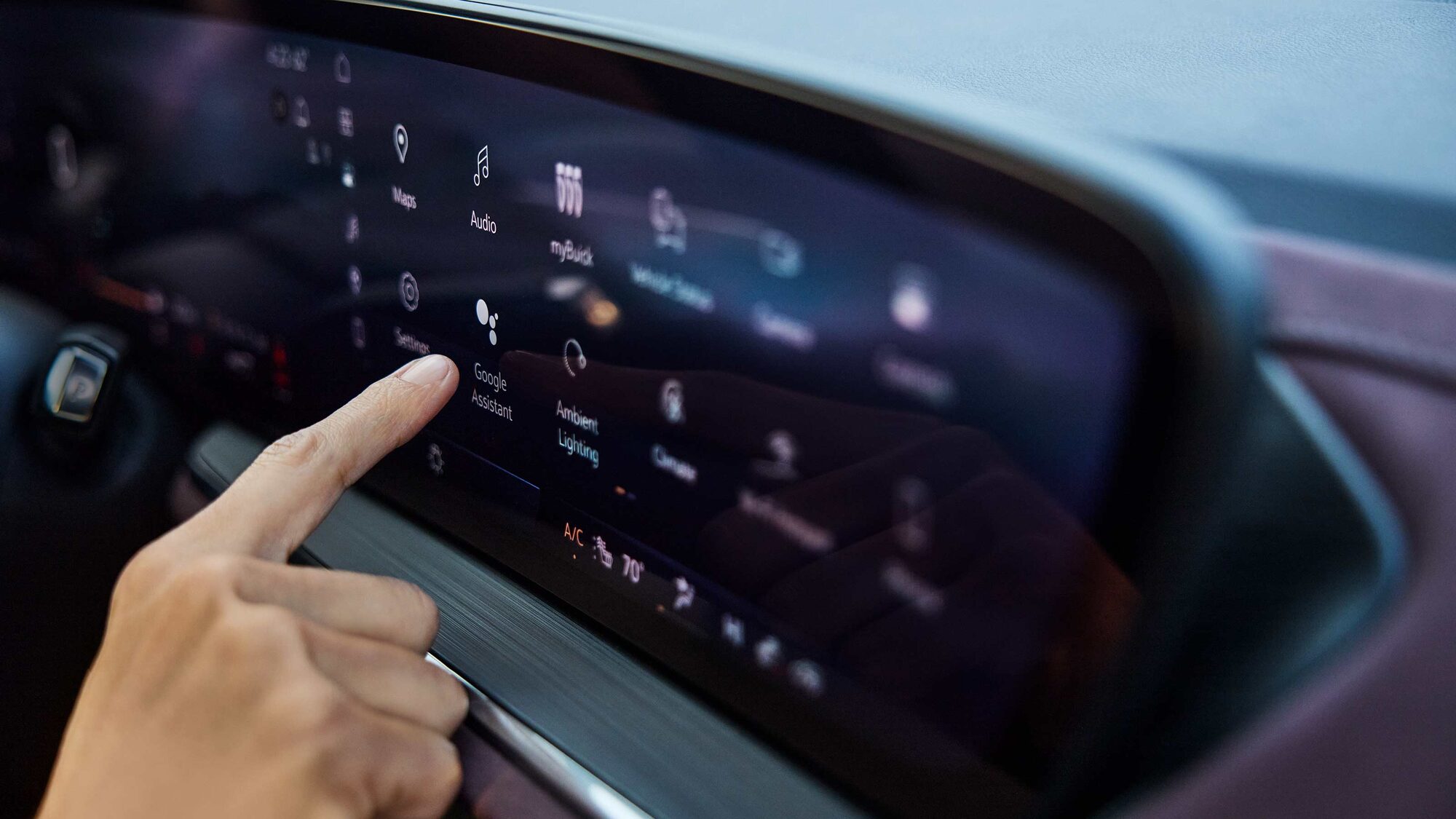 Close-up of the Driver Pressing an App on the Buick Vehicles Infotainment Screen