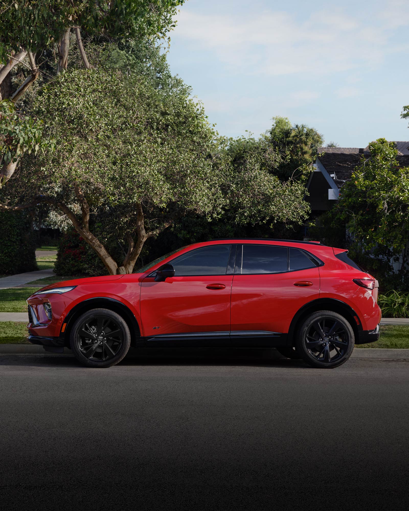 Profile View of a Red 2026 Buick Envision Compact SUV