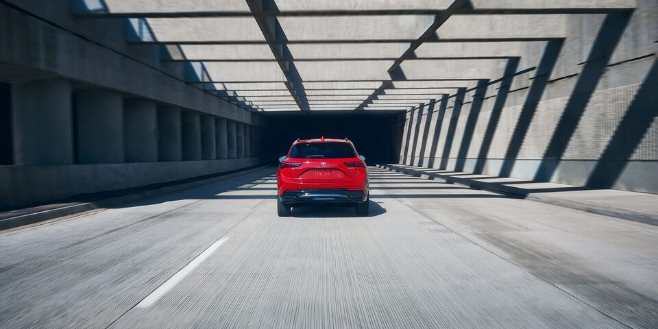 Rear View of the 2026 Buick Envision Compact SUV Driving Down the Freeway
