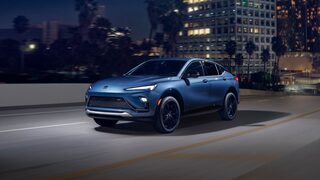 Three-quarters View of the 2026 Buick Envista Driving Out of the City Under a Street Light