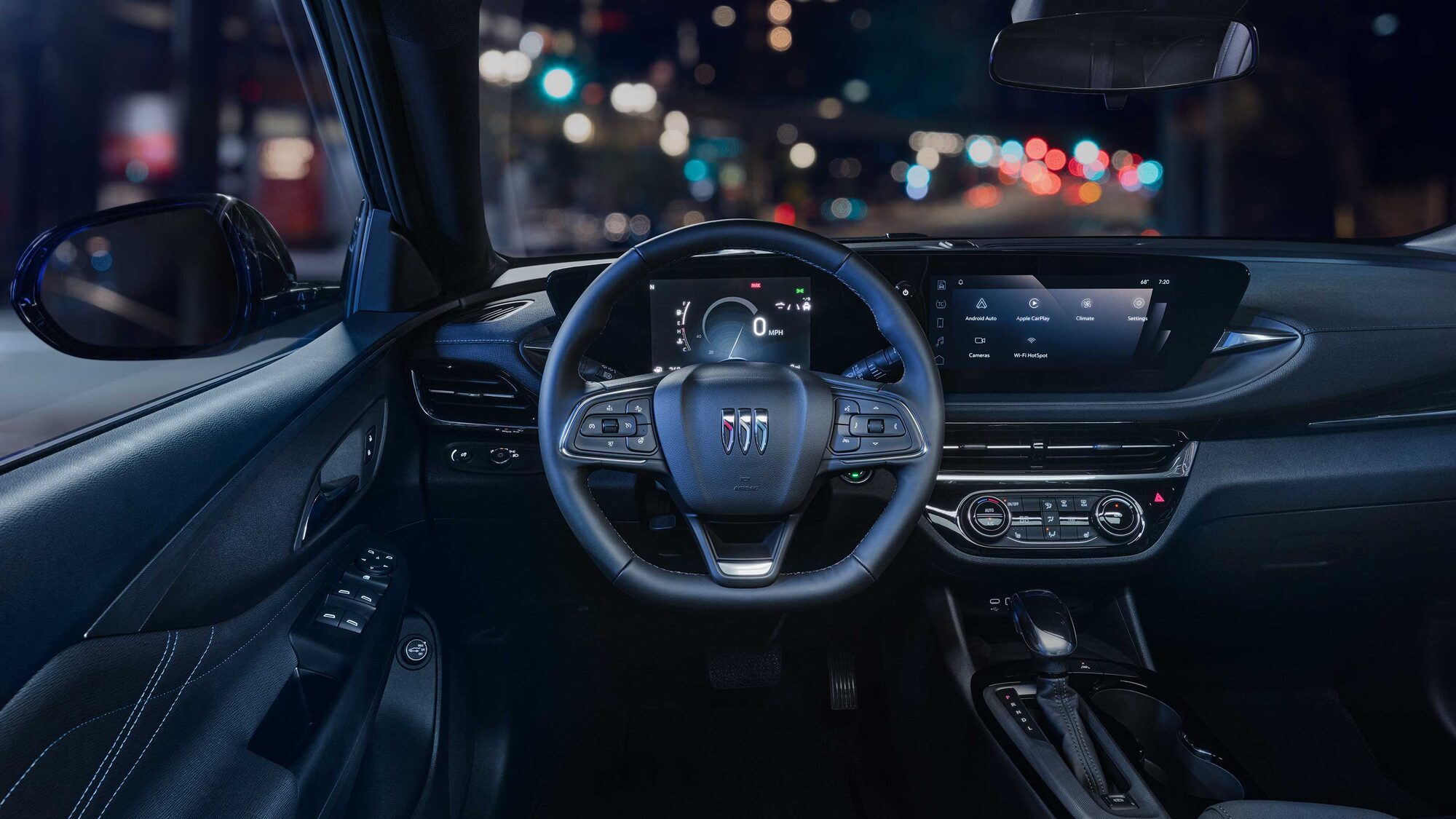 Driver Seat View of the 2026 Buick Envista Cabin and Interior Outlooking the Blurry City at Night