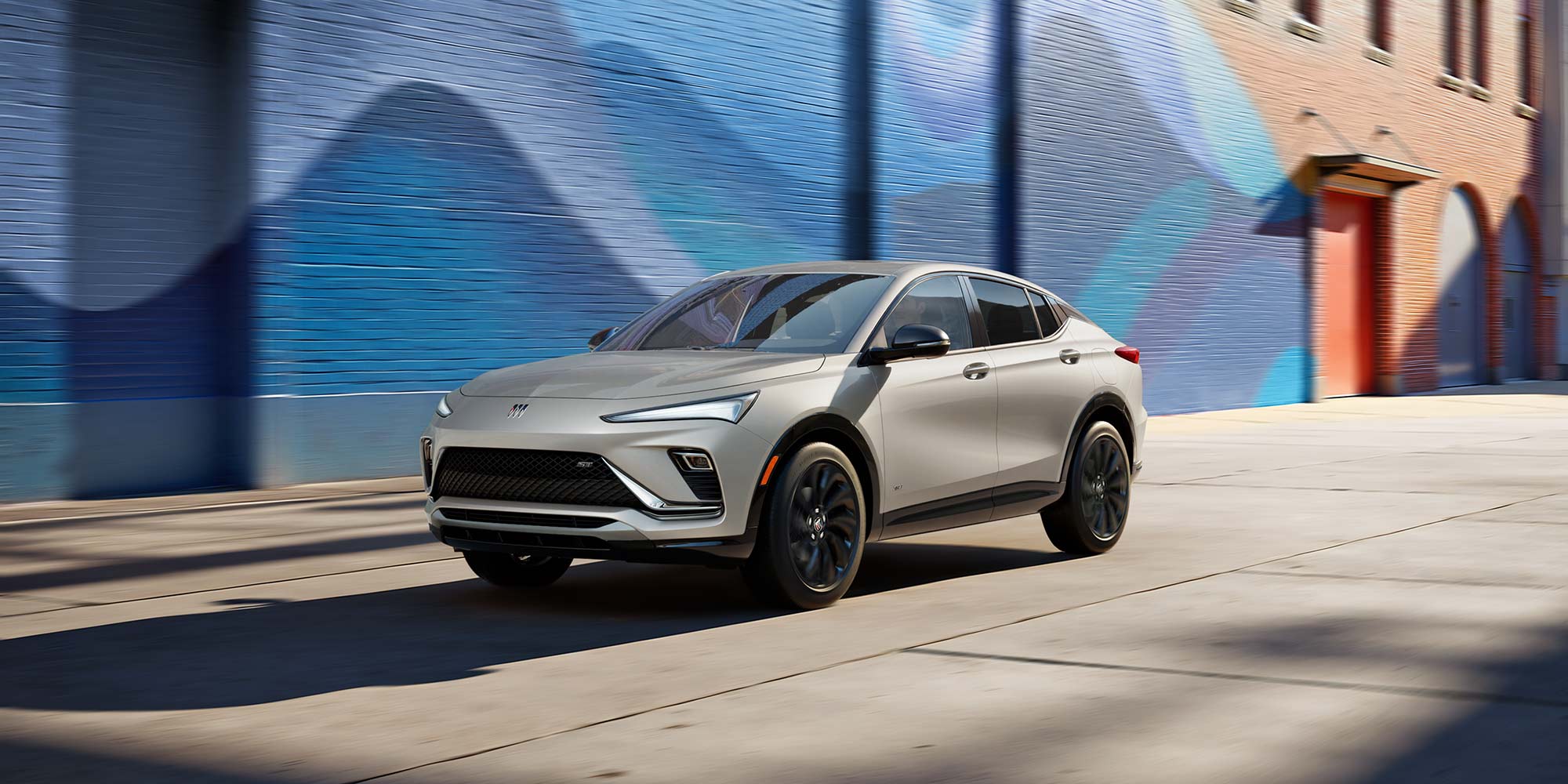 Front View of the 2026 Envista ST SUV with the Studio Series package Driving Down a City Steet