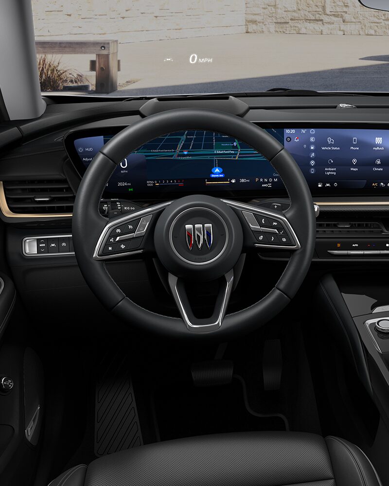 Close-up of the Buick Envision Avenir Interior Drivers Side View of the Steering Wheel and Dashboard