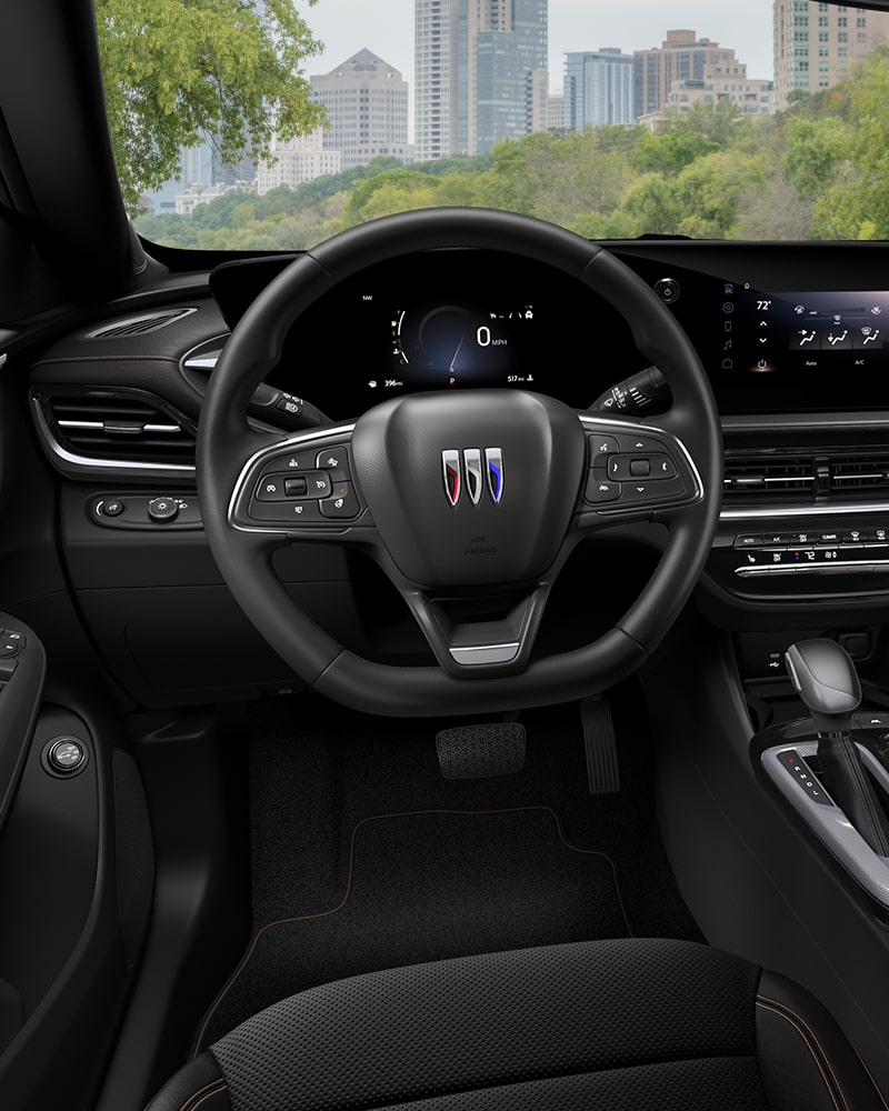 Close-up of the Buick Envista Avenir Interior Drivers Side View of the Steering Wheel and Dashboard